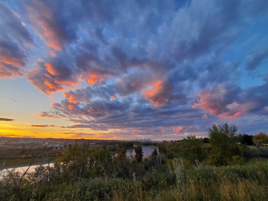 A summer sunset overlooking the Bow River valley in Calgary, Alberta. 